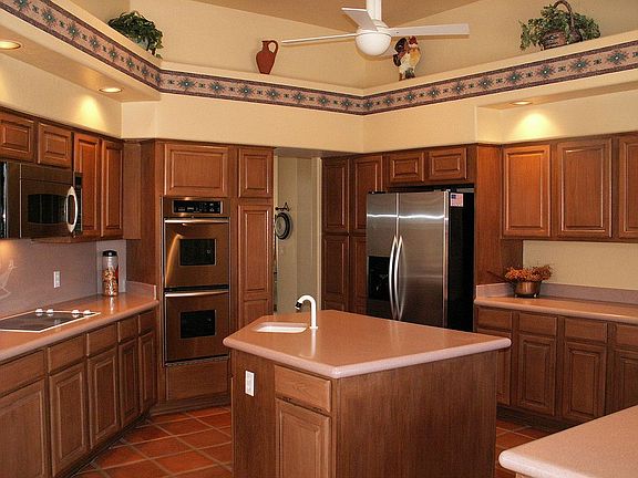Warm open kitchen w/stainless steel appliances