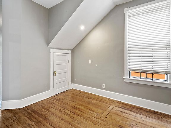 Downstairs Study Area with Lots of Storage Space Under Stairs