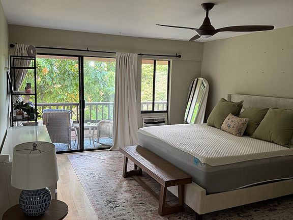 Master bedroom with large bath and lanai with happy shower tree