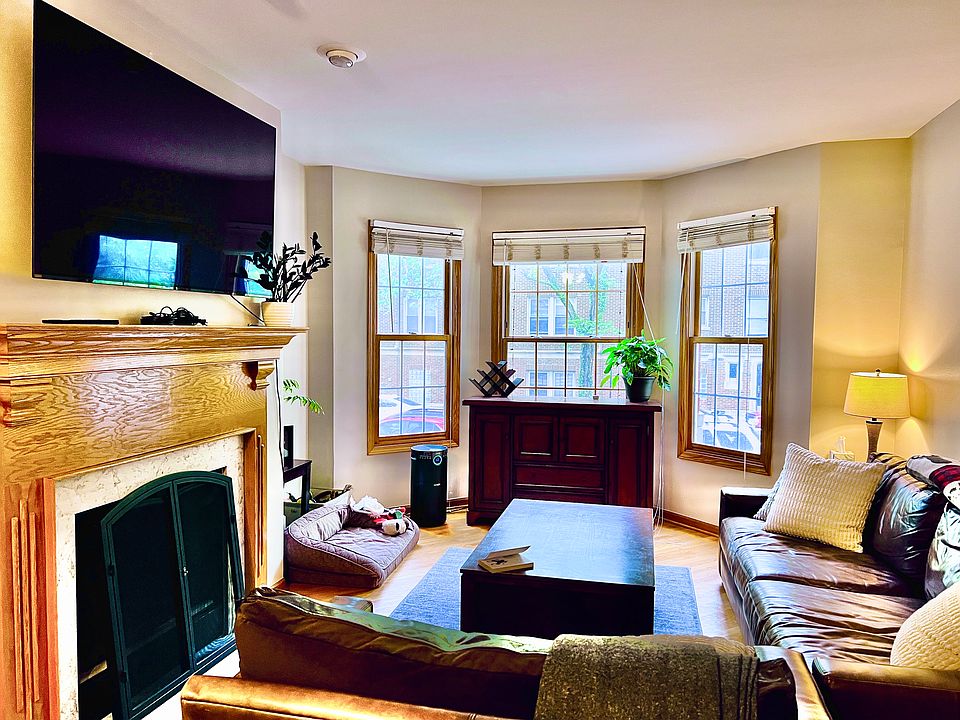 Mantel above fireplace easily fits TVs up to 85 inches. Main living room houses extra-large sectional sofas with room to spare!