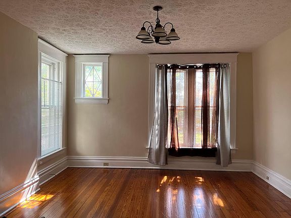 Large bedroom with wonderful lighting and windows