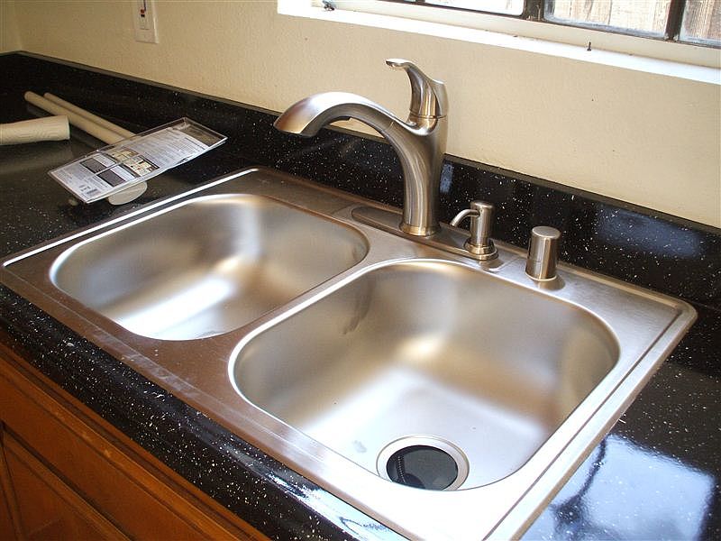 Stainless steel sink, custom countertops