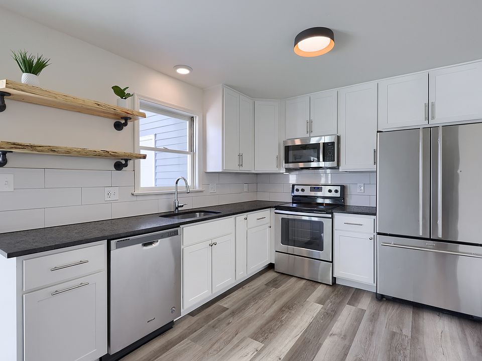 Kitchen with new cabinets, appliances, flooring, & granite countertops