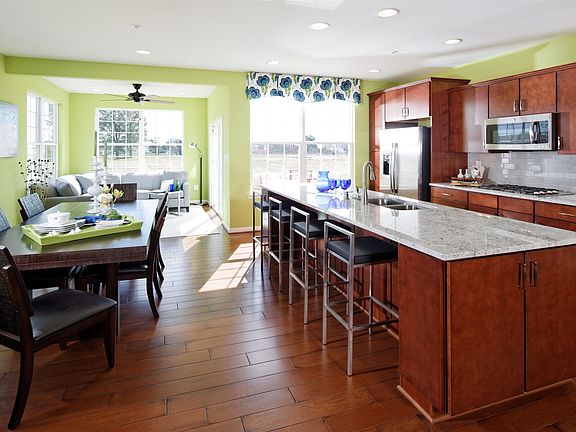 Open gourmet kitchen and sunroom