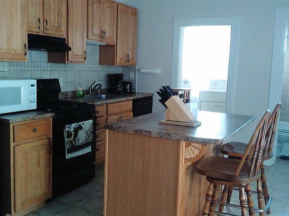 kitchen with laundry room including washer and dryer if desired