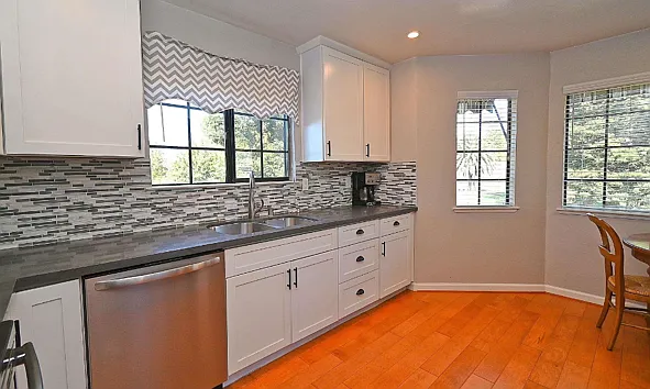 Kithen Right Side with Table facing the 10th Hole. Refrigerator opposite dishwasher on right side not shown