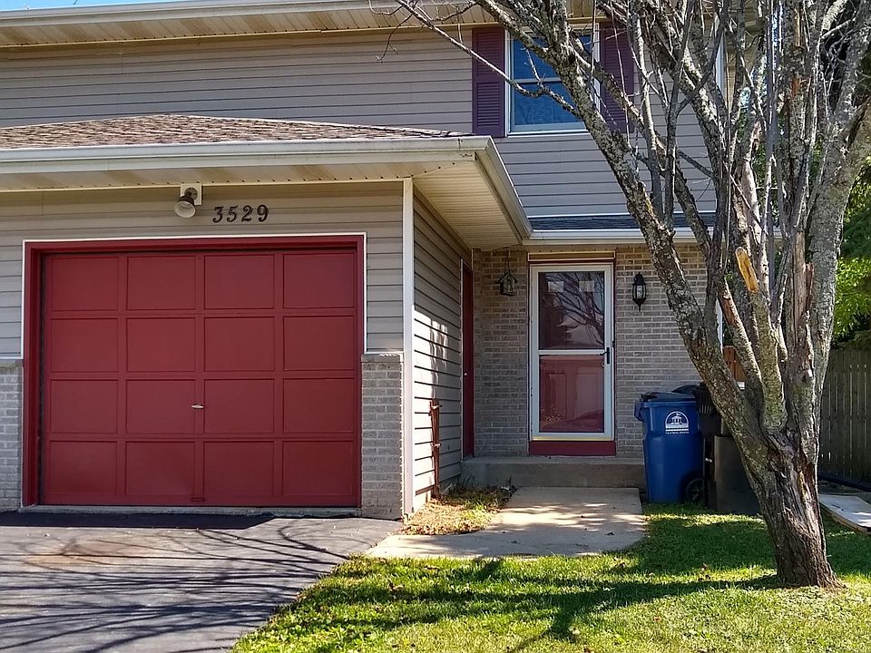 Front of property with single car garage.