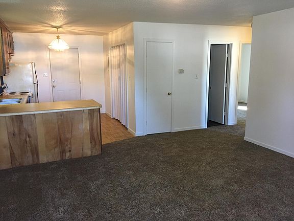Large living room, countertop can accommodate barstools. Room in kitchen for a tiny table.
