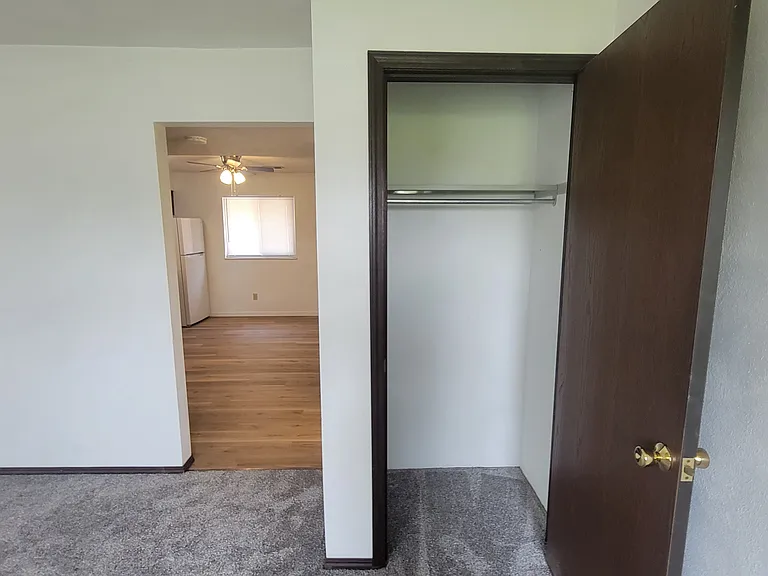Living room has a coat closet.