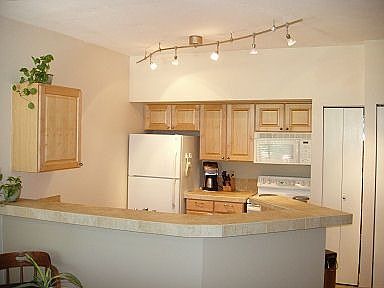 Kitchen: new counters, lighting, flooring