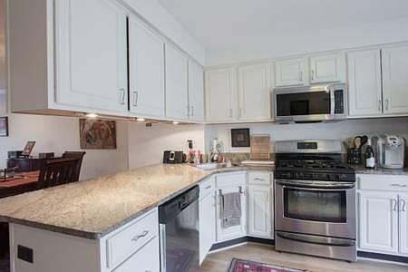 Kitchen with stainless steel appliances and granite countertops