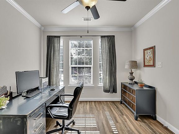 The private study with French Doors is located at the front of the house. Large windows provide beautiful natural light.