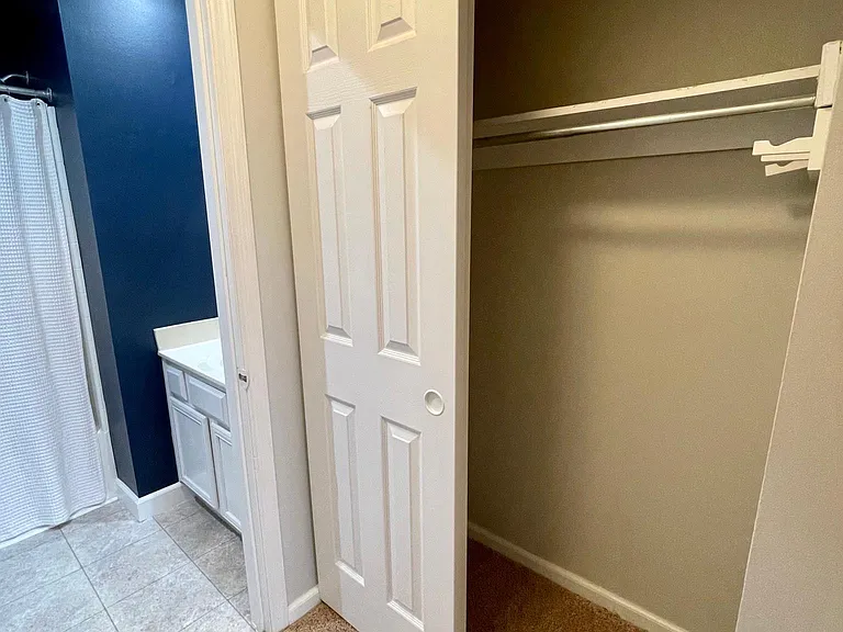 The master bedroom features two closets for ample storage space.