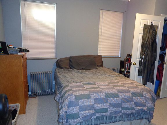 Bedroom with two windows and closet