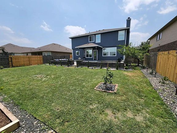 Rear view of the home with tinted windows