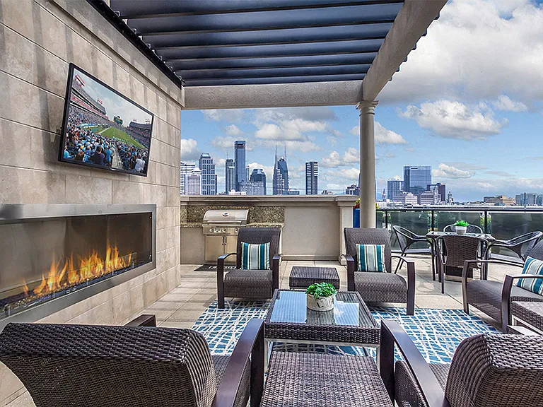 Rooftop lounge with outdoor fireplace, grill and amazing views of downtown