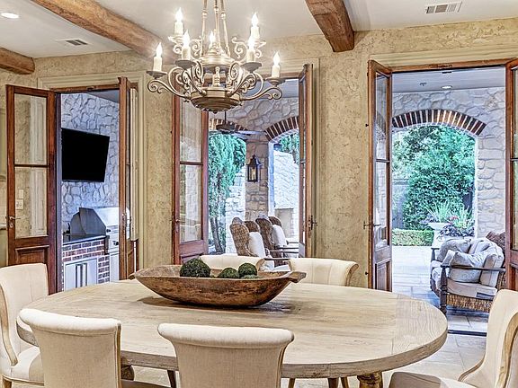 You truly get the sense that you are not in Houston, but a charming Villa in the European countryside! 10' ceilings with authent