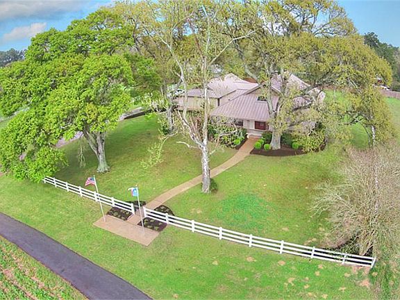 Home features a lifetime metal roof, recent ACs, double paned windows.