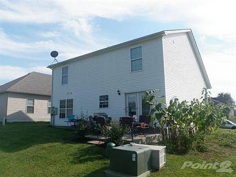 Rear view of this 1 1/2 story home