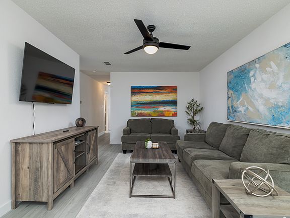 Spacious living room with plenty of seating for friends and family.