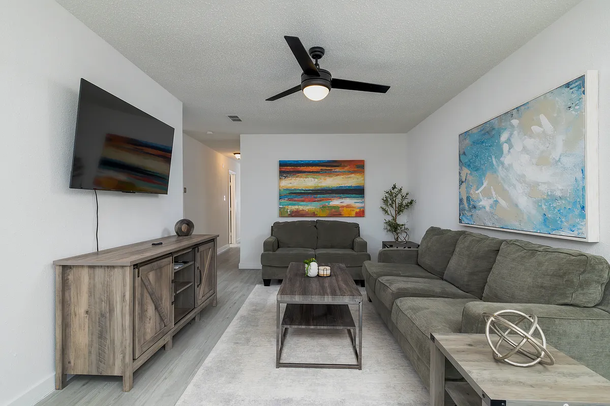Spacious living room with plenty of seating for friends and family. - 1704 Kynette Dr #B
