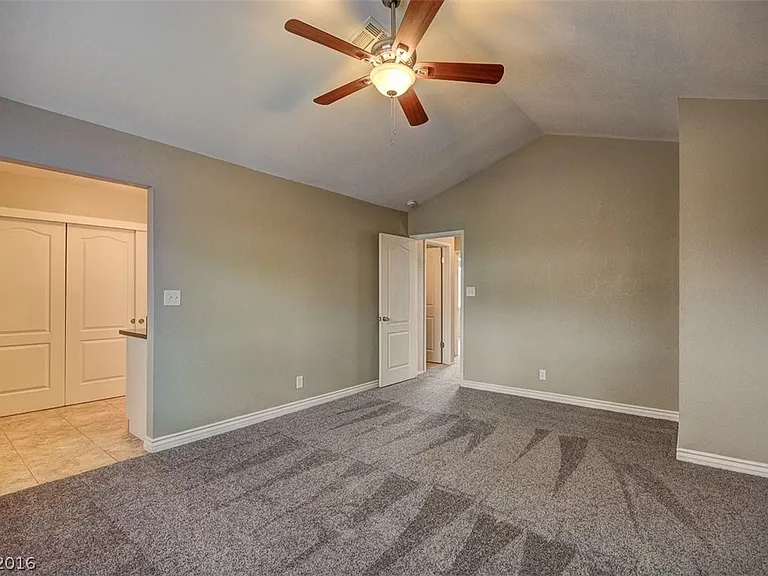 The flooring has been upgraded to laminate_there is no longer any carpet in this room