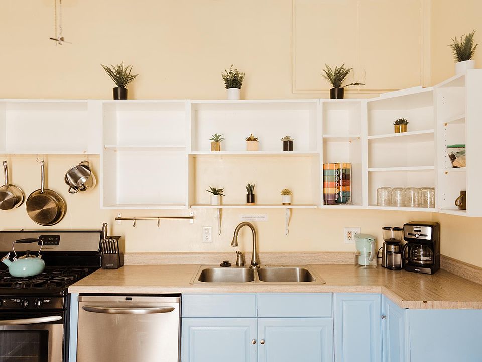 Spacious kitchen with a lot of storage and stainless steel appliances