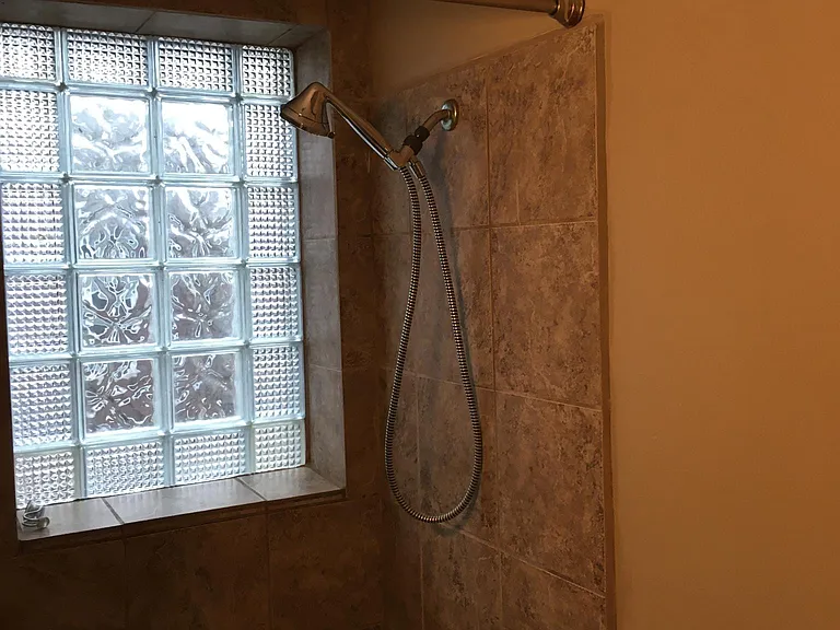 Shower area with glass block
