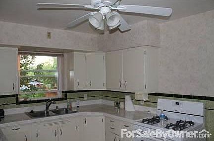 Updated kitchen offers modern amenities
						:
						9 1/4' x 12' space includes tiled counter, gas stove, dishwasher and disposal