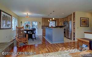 Open kitchen, dining and living areas