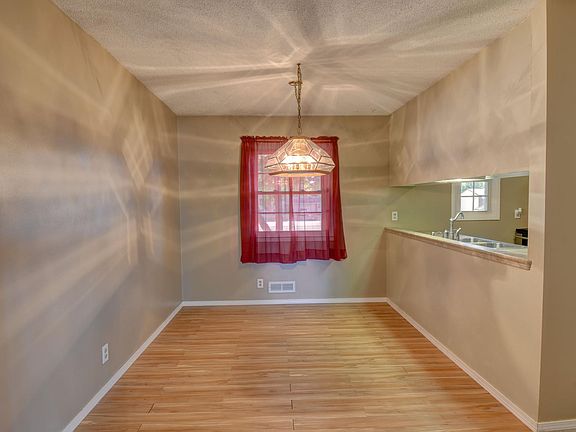 The dining room with wood laminate flooring.