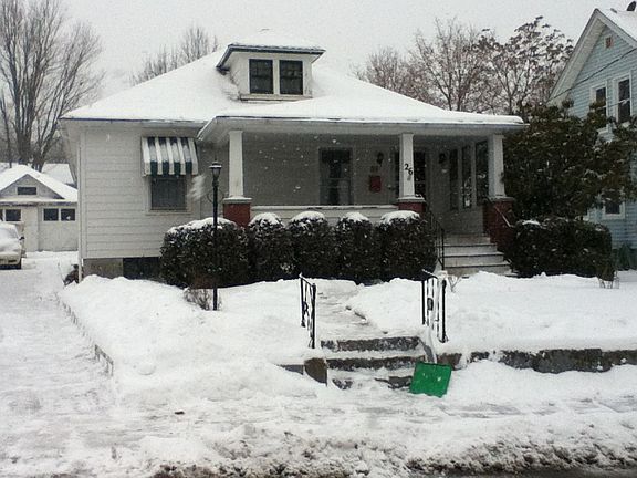 Winter street view of house 