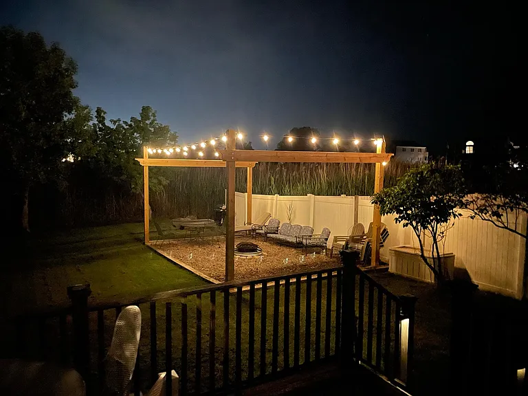 The fire pit lounge with solar powered cafe lights.