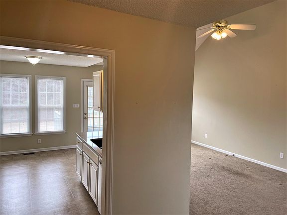 View from front entryway into open kitchen/livingroom area