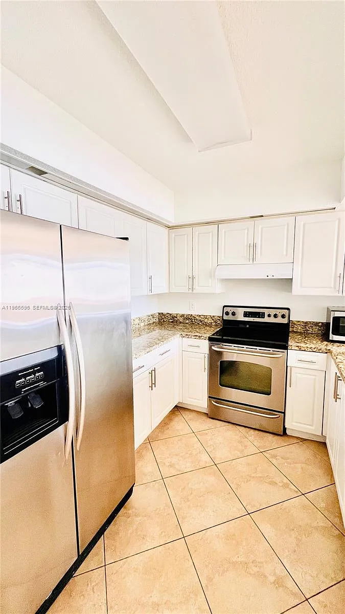 Building Photo - 18810 NW 57th Ave #201