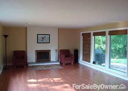 Living Room : Ample room for dining and living space. French doors open to back yard patio.