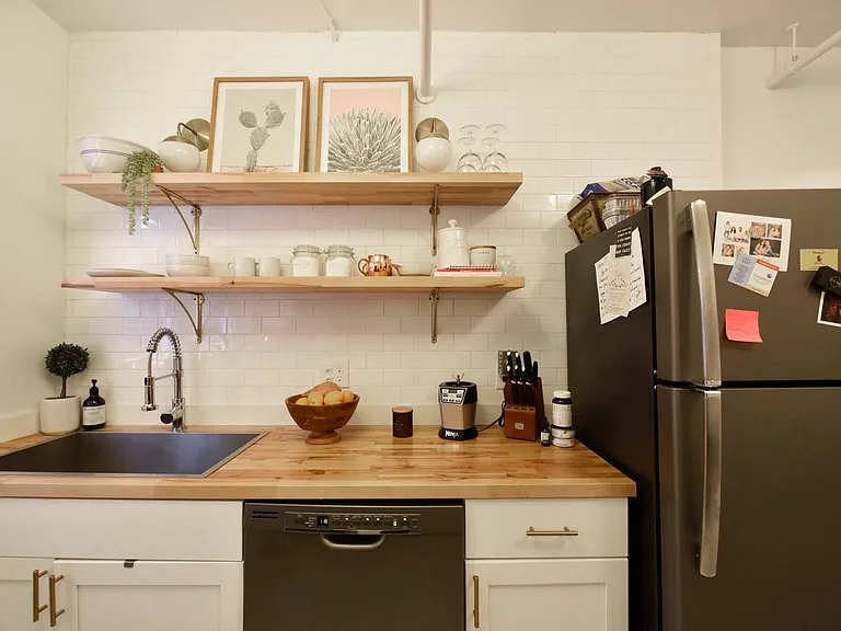 Kitchen with butcher slab counters & custom kitchen shelving