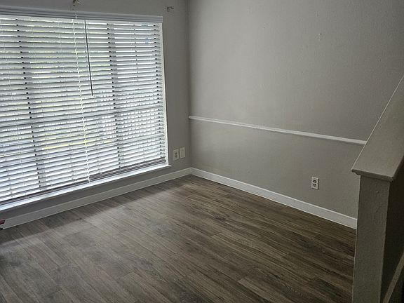 Front room by main entrance door with stairs to right