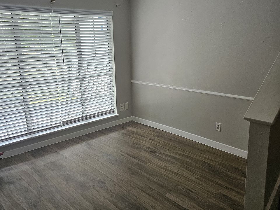 Front room by main entrance door with stairs to right