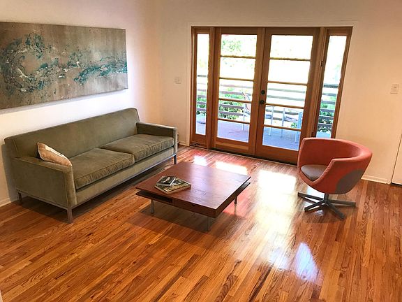 Living room leading to private deck