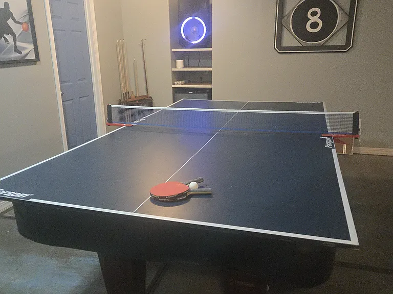 Basement: Ping-pong accessory on top of pool table