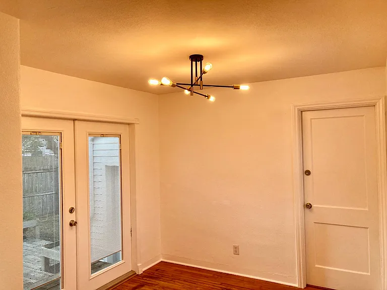 Dining room, door to deck and backyard, door to garage and laundry.