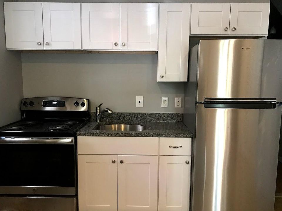 New kitchen with granite counters, stainless appliances, garbage disposal.