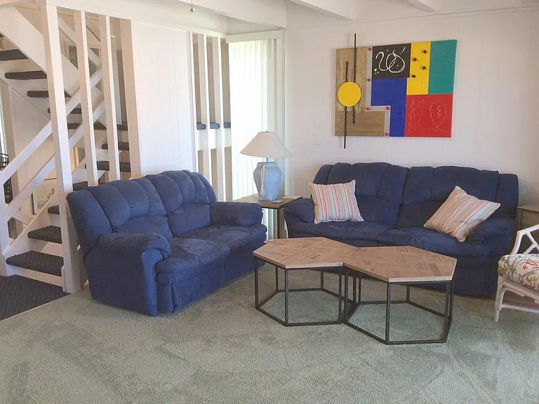 Living Room recreation area with sliding glass door direct access to the private beach.