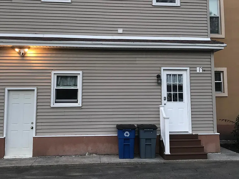 Rear entrance into expansive mudroom