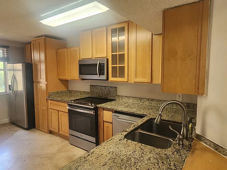 8871 Wiles Rd — Photo 1