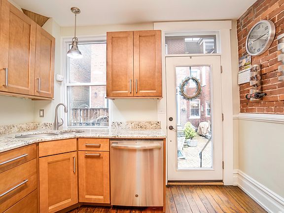 kitchen that leads to the outdoor courtyard