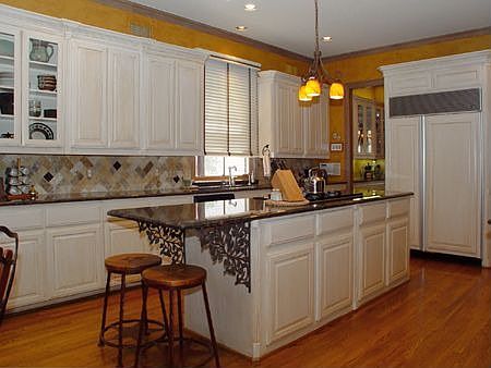 Recently updated gourmet kitchen with granite counters and large island