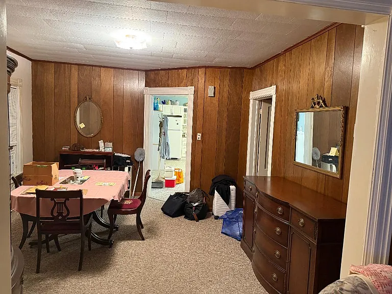 view of ding room, paneling will be painted off white