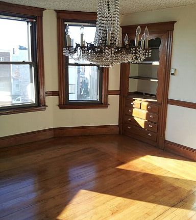 Dining room with chandelier and hutch